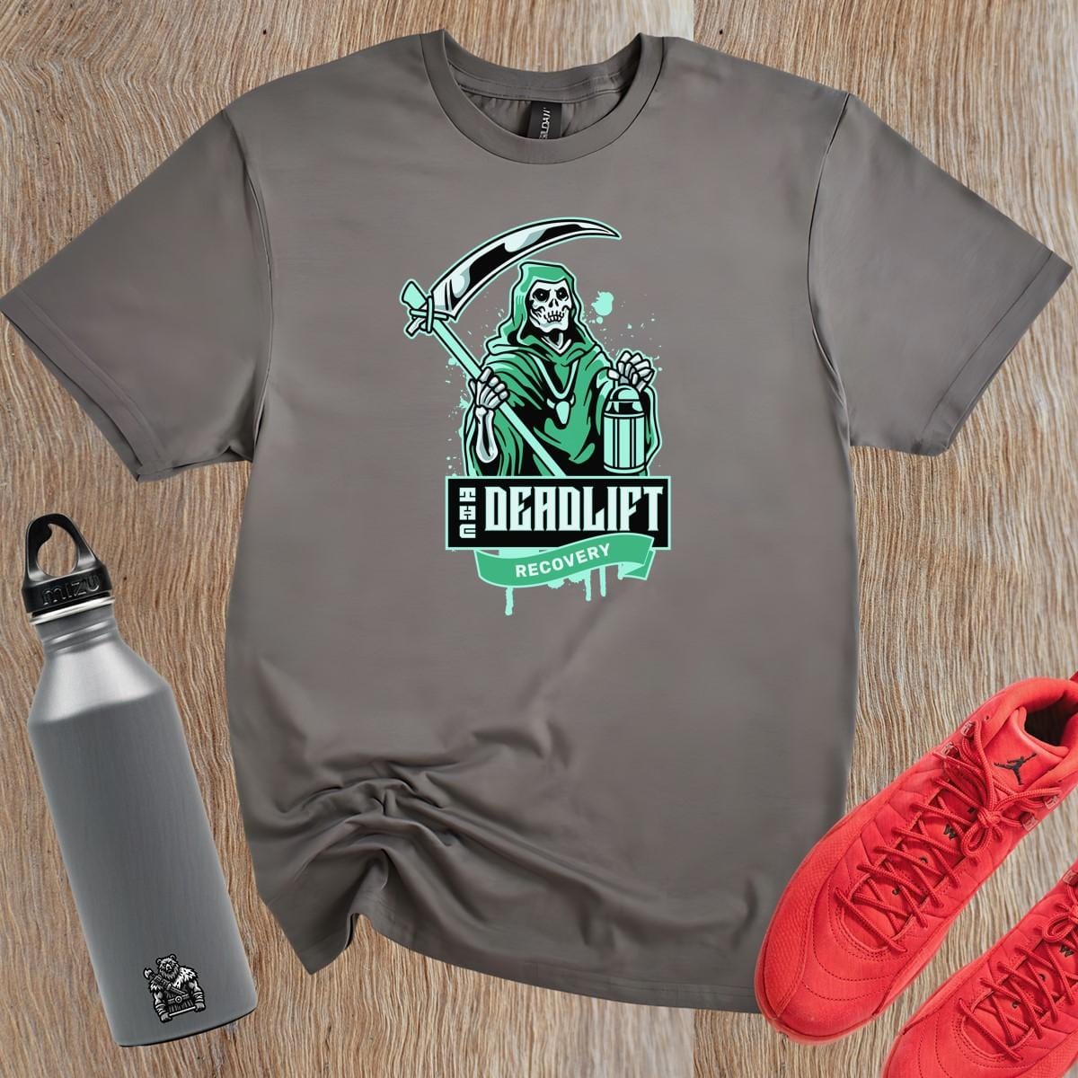 "Graphic gym t-shirt featuring bold 'Deadlift Recovery' design, perfect for fitness enthusiasts showcasing humor and strength."