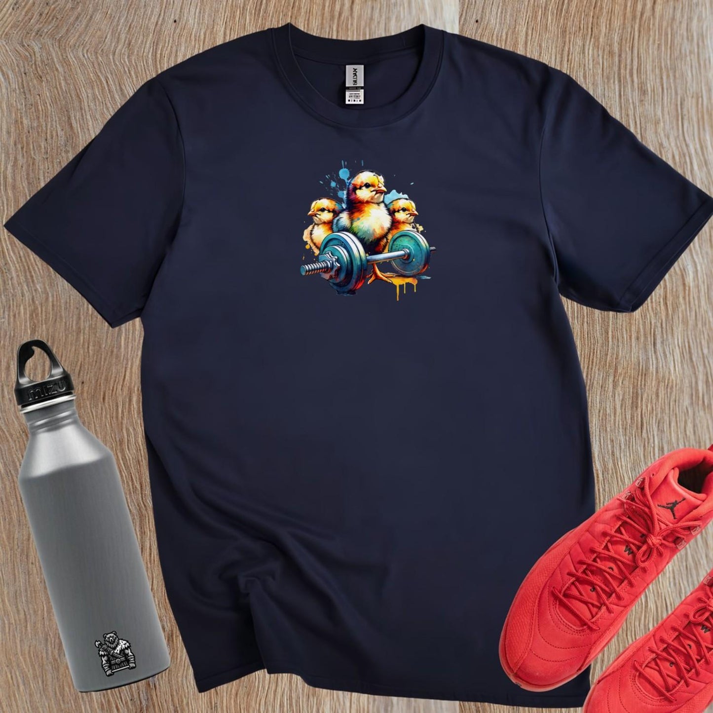 "Vibrant gym T-shirt featuring playful chicks lifting weights, showcasing a fun design for fitness enthusiasts. Perfect for workouts!"