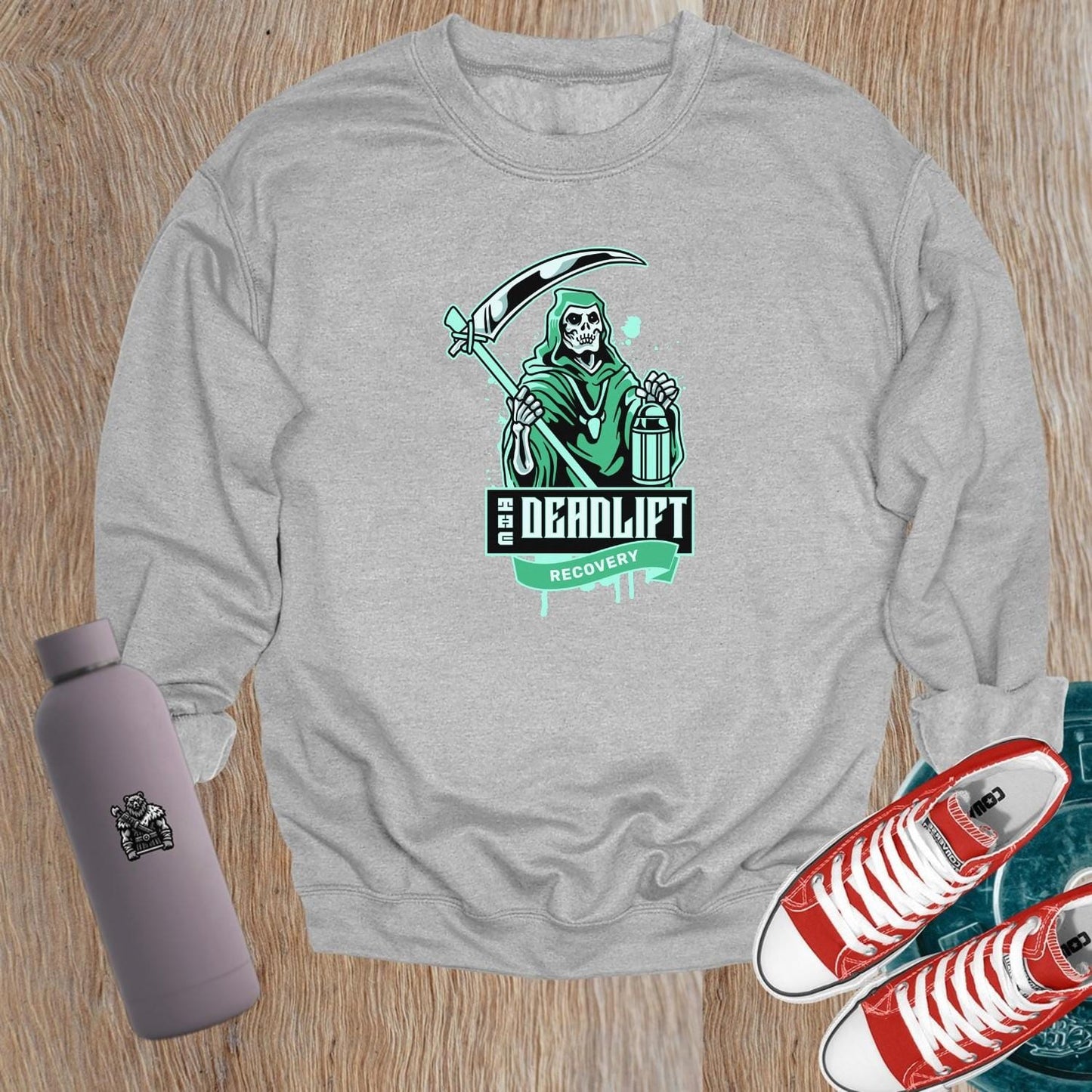 "Graphic sweatshirt featuring a bold lifter design, ideal for gym enthusiasts. Perfect for post-workout comfort and style."