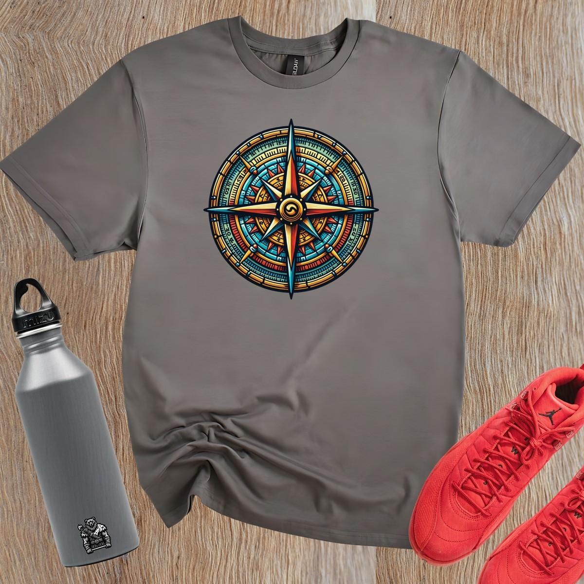 "Vibrant compass-themed gym T-shirt featuring motivational graphic, perfect for fitness enthusiasts seeking adventure and courage."