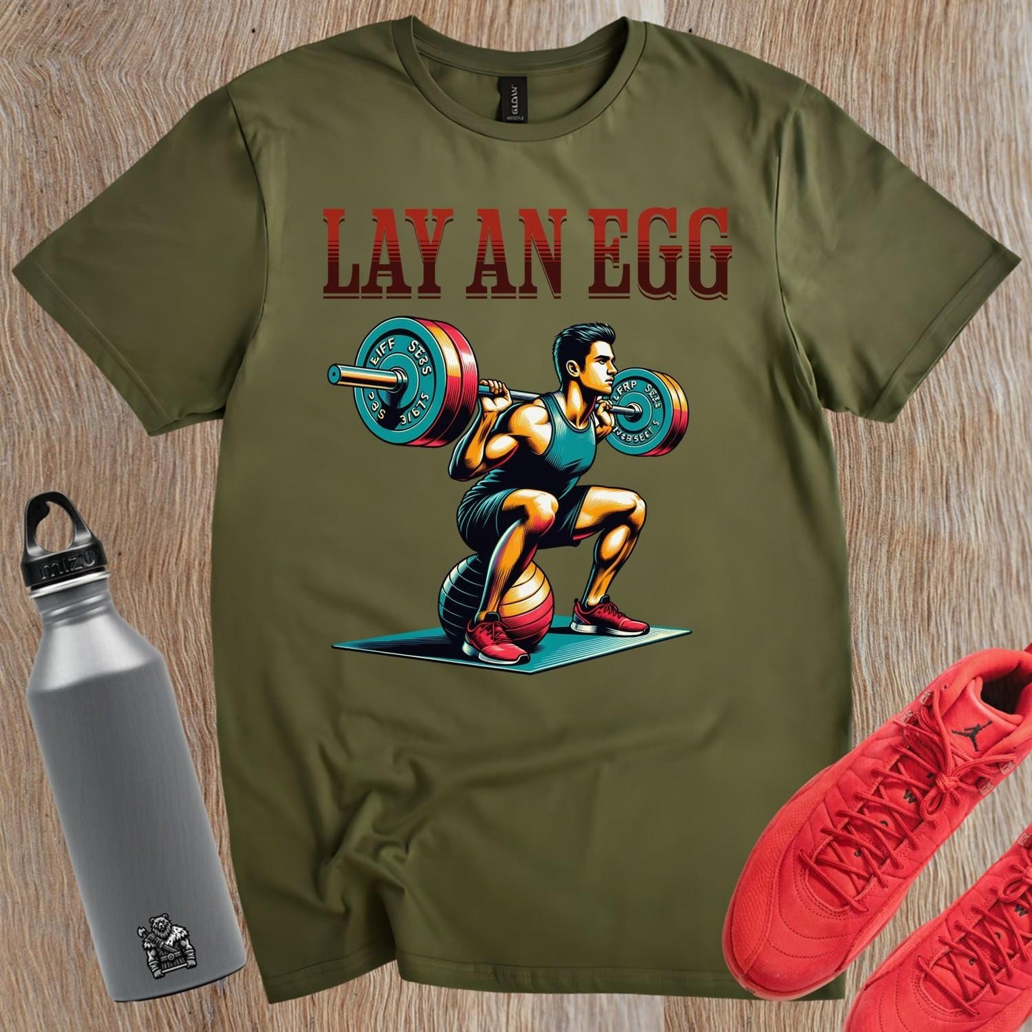 "Graphic gym T-shirt featuring 'Lay An Egg' design, showcasing humor in fitness. Ideal for workouts, casual outings, and style."