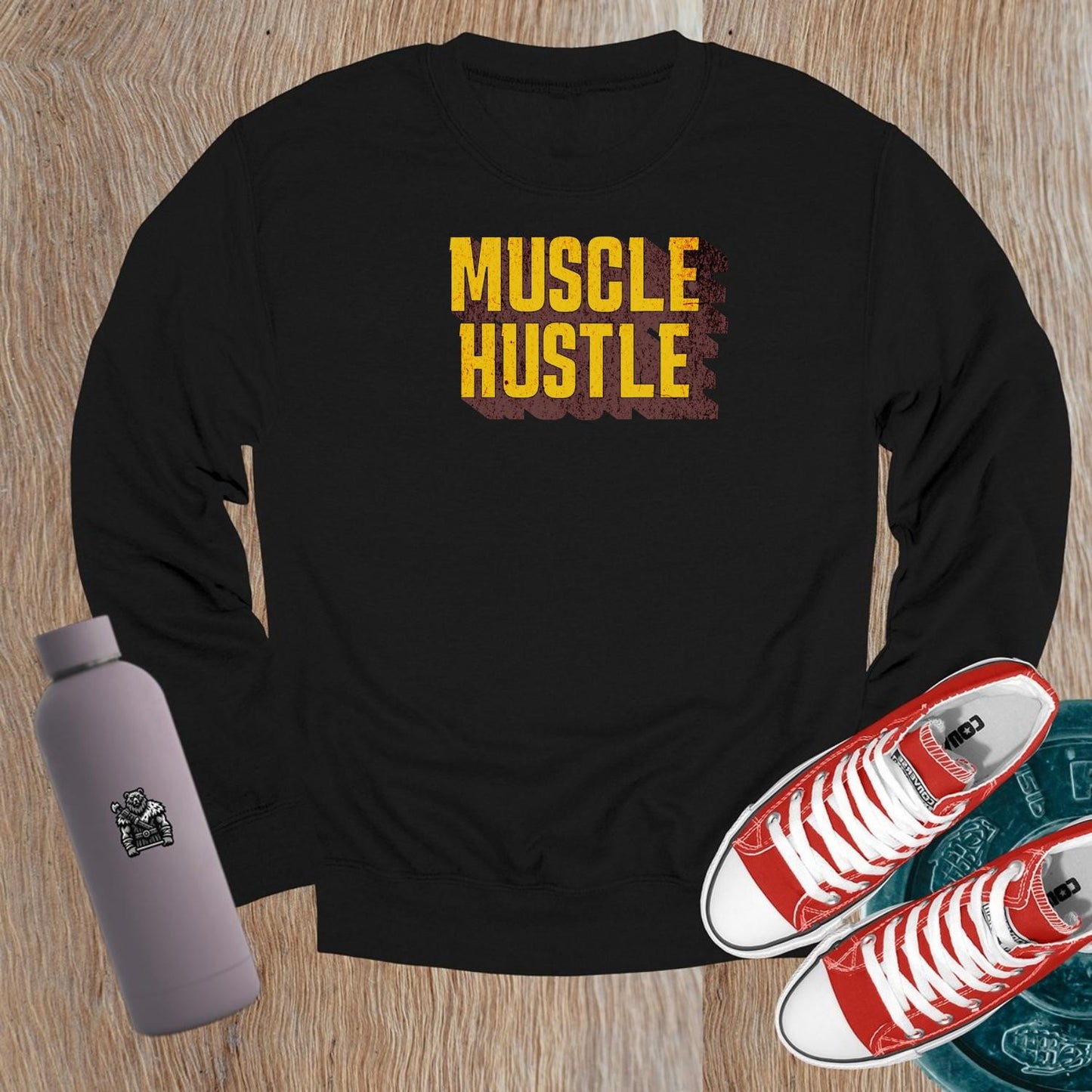 "Muscle Hustle crewneck sweatshirt for workouts, featuring bold design and comfortable fit, perfect for the gym or casual wear."