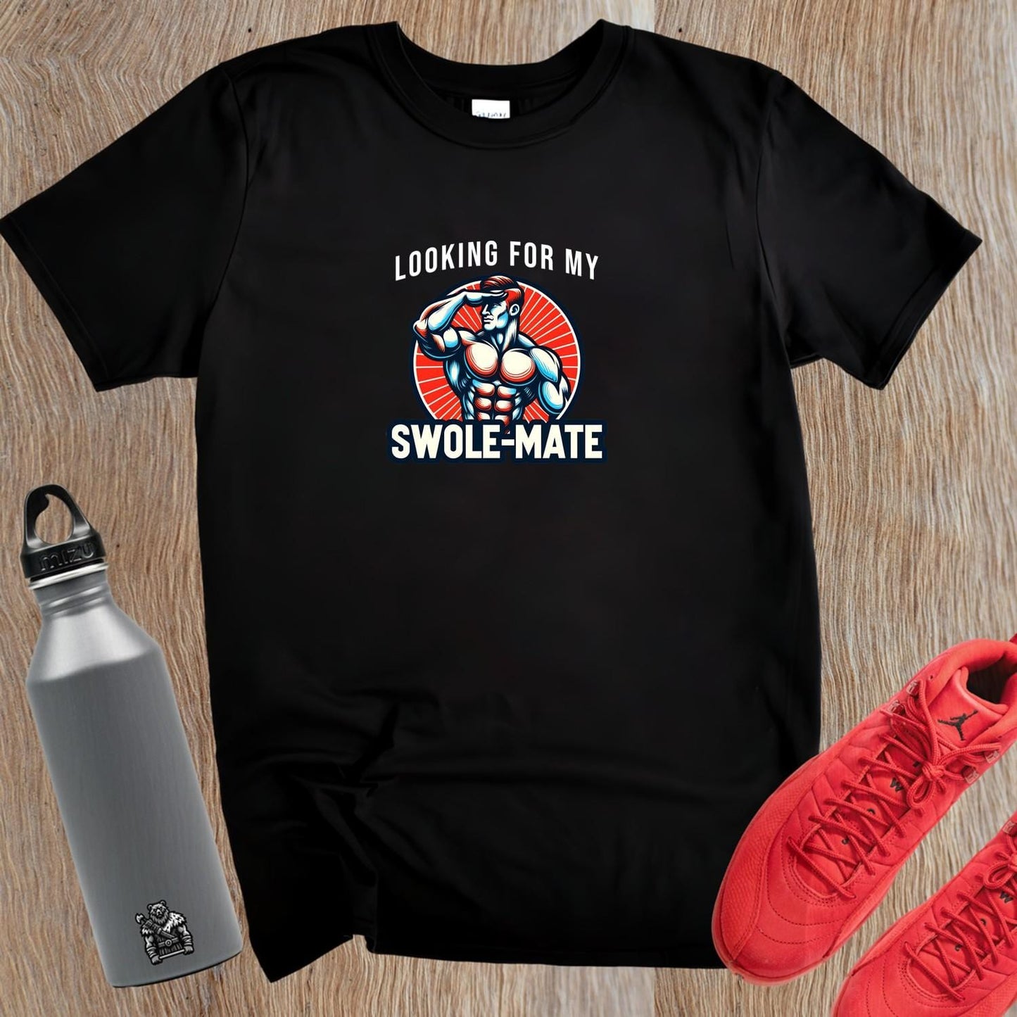 Alt text: "Swole-Mate T-shirt design featuring bold lettering and a fit silhouette, perfect for gym workouts and casual outings. Show your dedication to fitness and join the community of fitness enthusiasts."