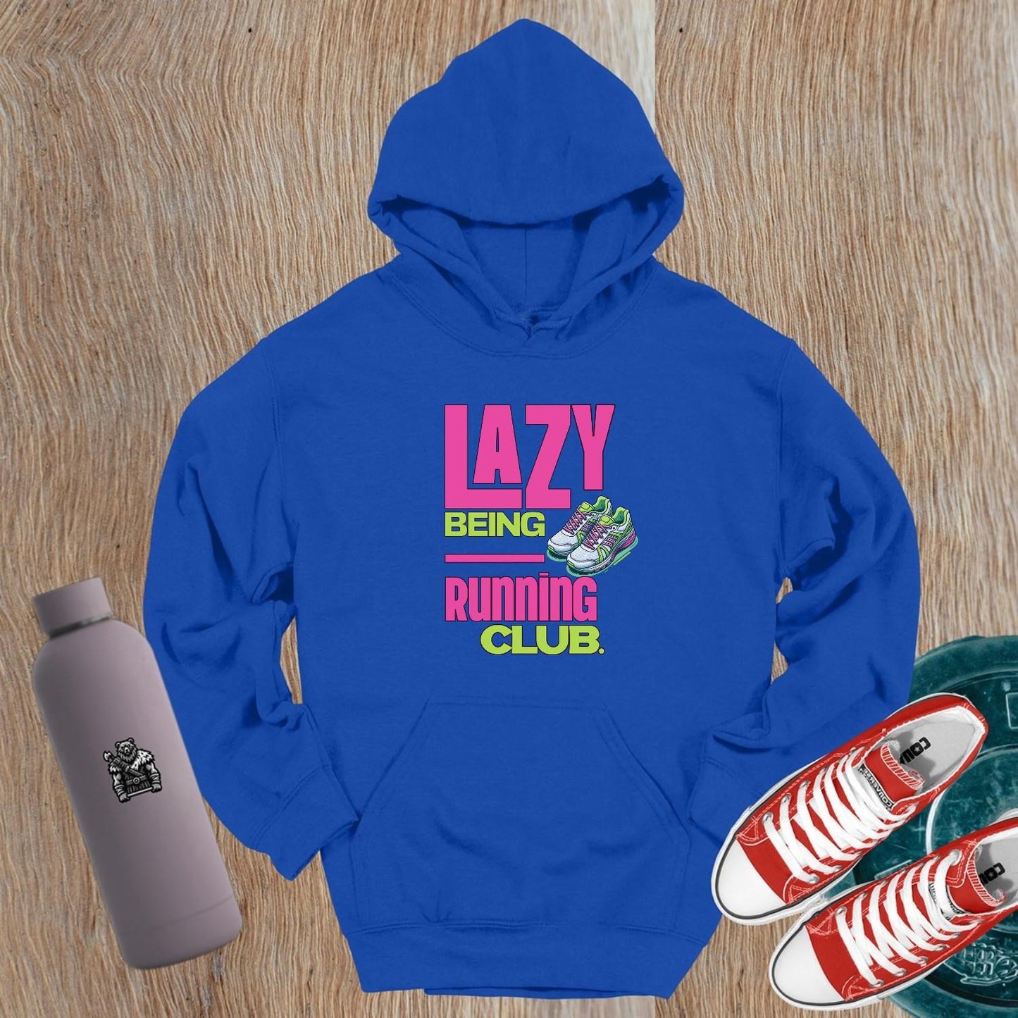"Vibrant 'Lazy Being Running Club' hoodie featuring a playful graphic, perfect for gym workouts and lounging in style. Activewear essential!"
