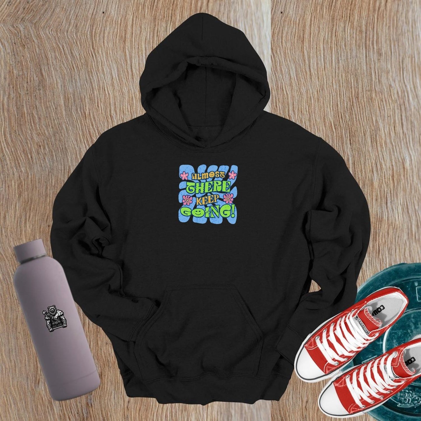 Alt text: "Vibrant gym hoodie featuring motivational 'Almost there, keep going!' graphic, perfect for workouts and post-gym style."