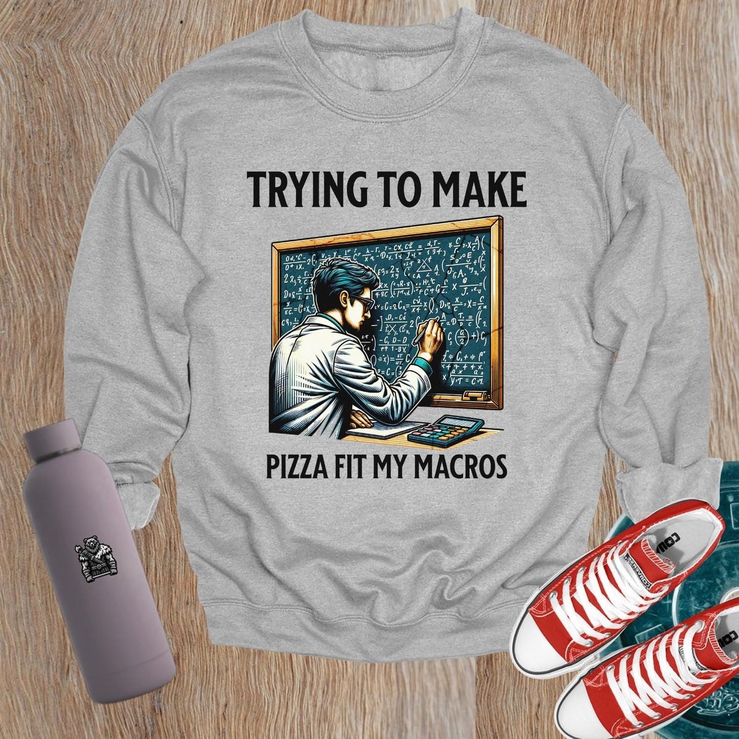 Alt text: "Witty 'Trying to Make Pizza Fit My Macros' sweatshirt design, featuring fitness-themed graphics. Perfect for gym enthusiasts."