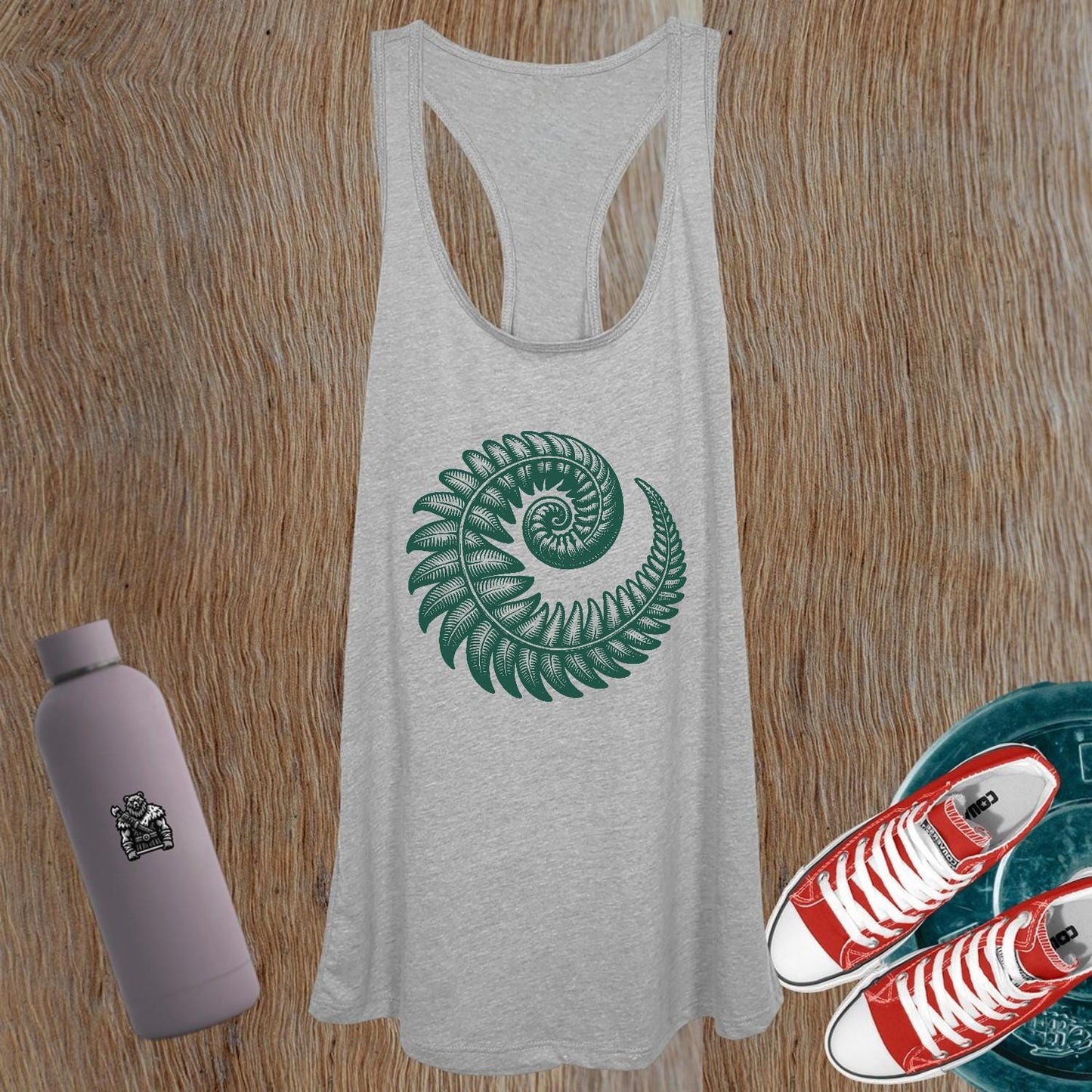 "Stylish women's gym tank top featuring a striking fern design, perfect for workouts and casual wear, offering comfort and athletic flair."