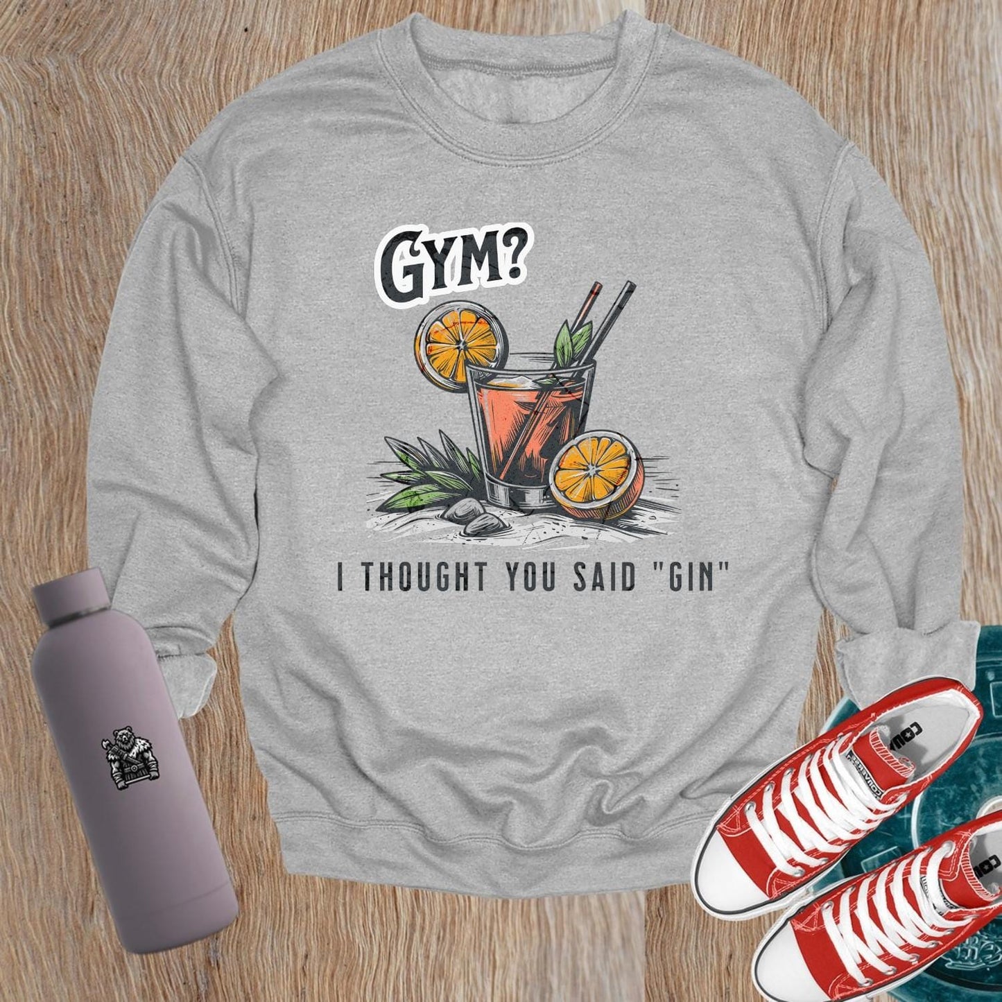 Alt text: "Playful 'Gym? I Thought You Said Gin' graphic sweatshirt for gym enthusiasts, blending fitness humor and style. Perfect for casual wear."
