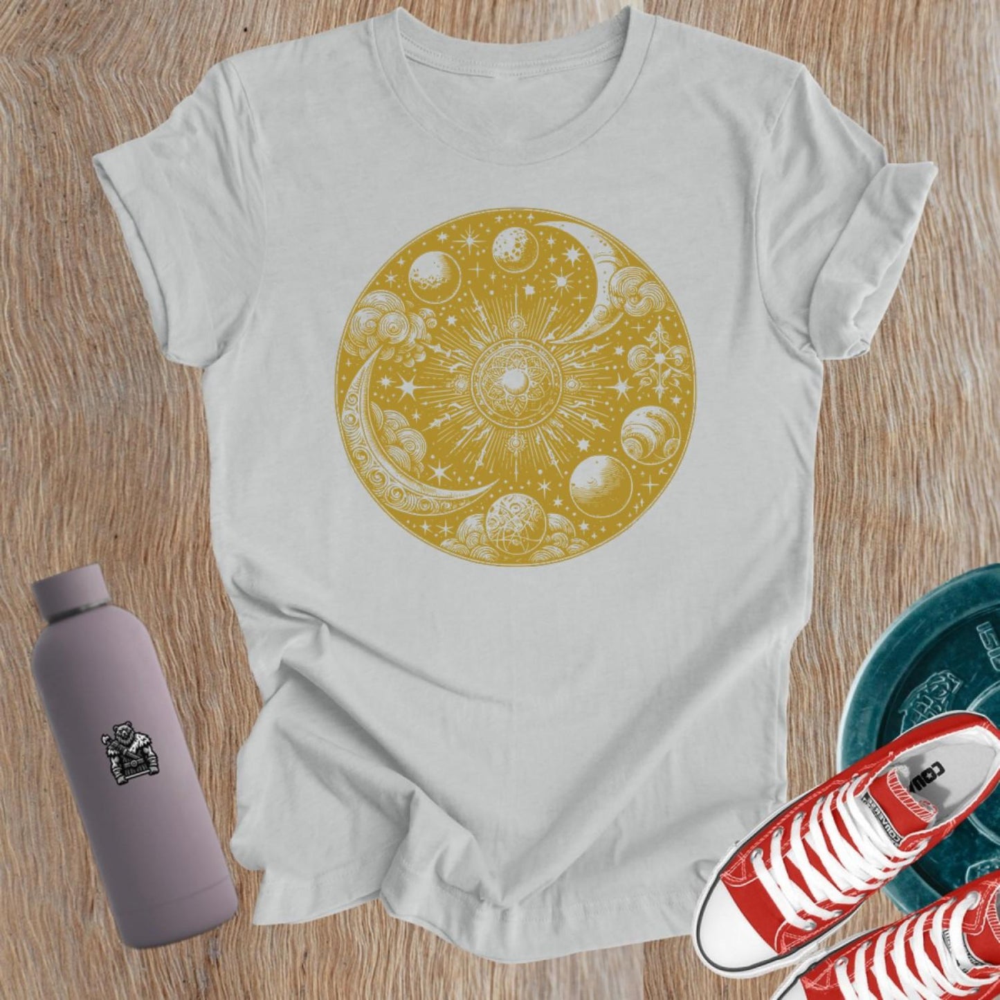 "Women's celestial design gym tee featuring strength symbols, perfect for weightlifting and activewear, blending flair with functionality."