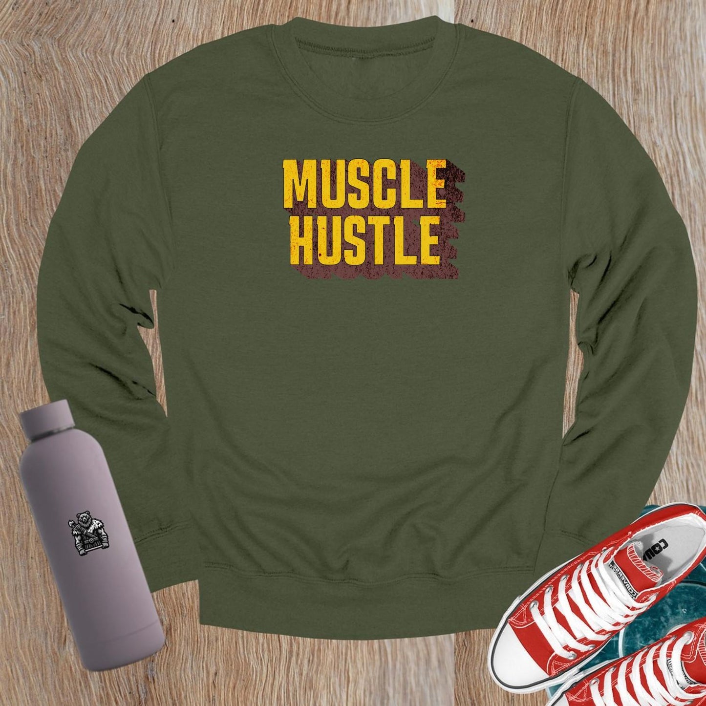 "Muscle Hustle crewneck sweatshirt for workouts, featuring bold design and comfortable fit, perfect for the gym or casual wear."