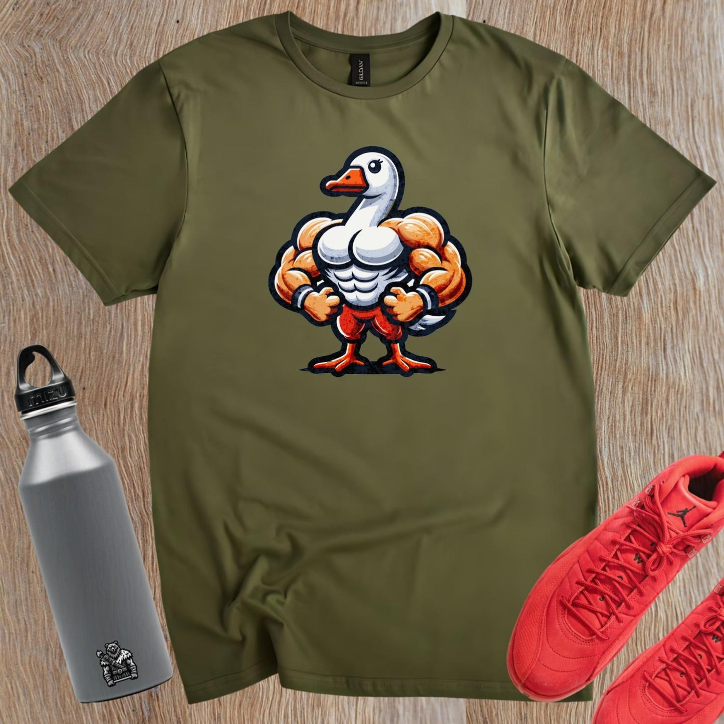 "Bold gym T-shirt featuring a muscle-bound goose design, perfect for workouts, fitness enthusiasts, and making a fun statement."