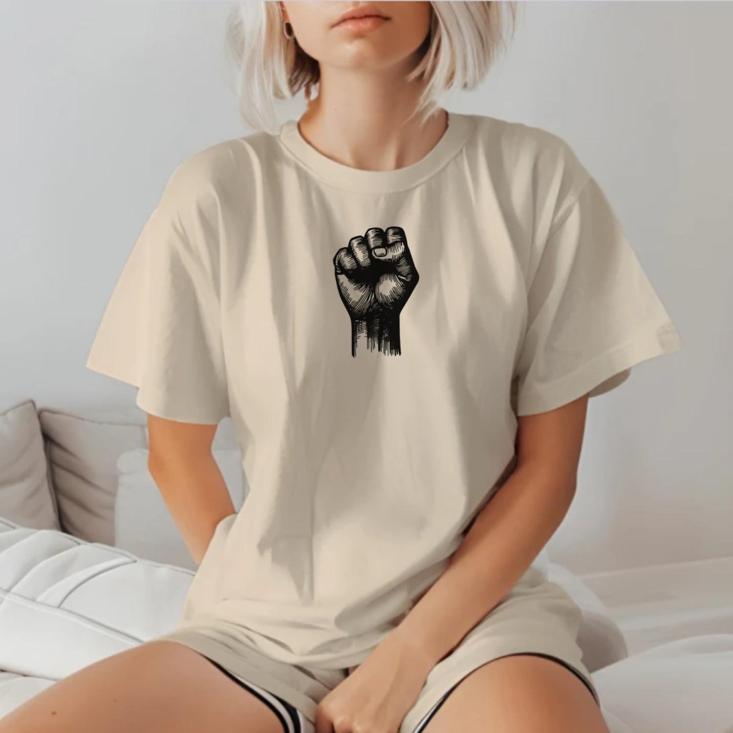 Alt text: "Bold gym t-shirt with a powerful raised fist graphic, symbolizing strength and determination for passionate fitness enthusiasts."