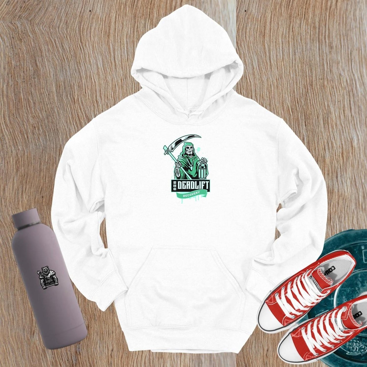 "Bold Deadlift Recovery hoodie featuring a dynamic skeleton graphic, ideal for gym enthusiasts seeking comfort and style in fitness wear."