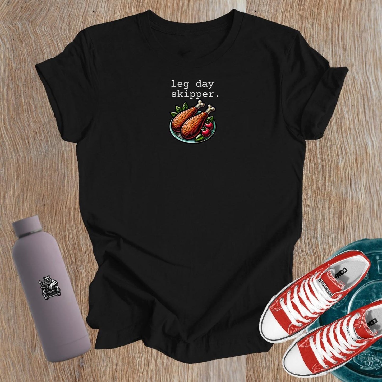 Alt text: "Women’s ‘Leg Day Skipper’ graphic T-shirt featuring bold, humorous design celebrating fitness balance, perfect for gym wear."