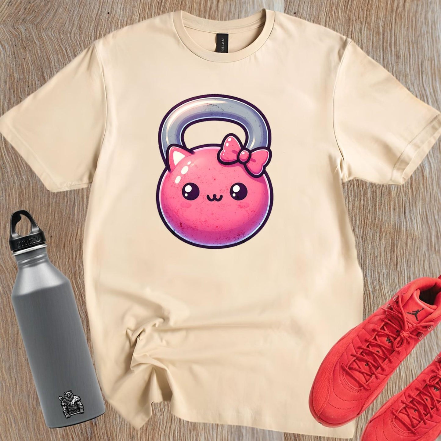 Alt text: "Kawaii Kettlebell T-shirt featuring a cute pink kettlebell with a bow, perfect for gym workouts and stylish casual wear."