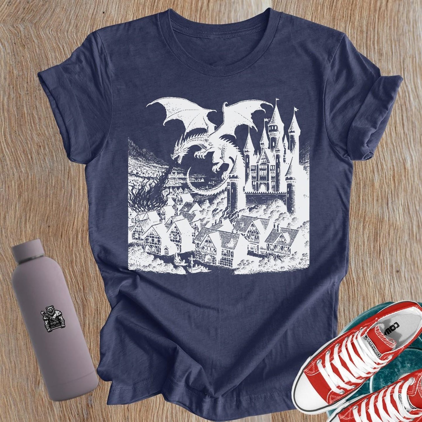 Bold graphic tee featuring a fierce dragon and castle design, perfect for strong women who lift. Ideal gym attire for fitness enthusiasts.