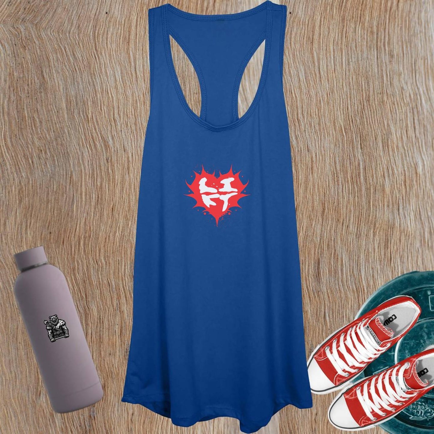 "Women's workout tank top featuring a bold heart design, symbolizing passion and power for fitness enthusiasts. Flattering fit, inspiring graphics."