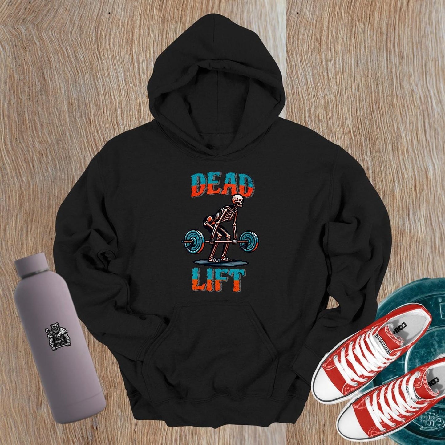 "Black 'Dead Lift' hoodie featuring a striking skeleton design, perfect for gym wear, fitness enthusiasts, and post-workout style."