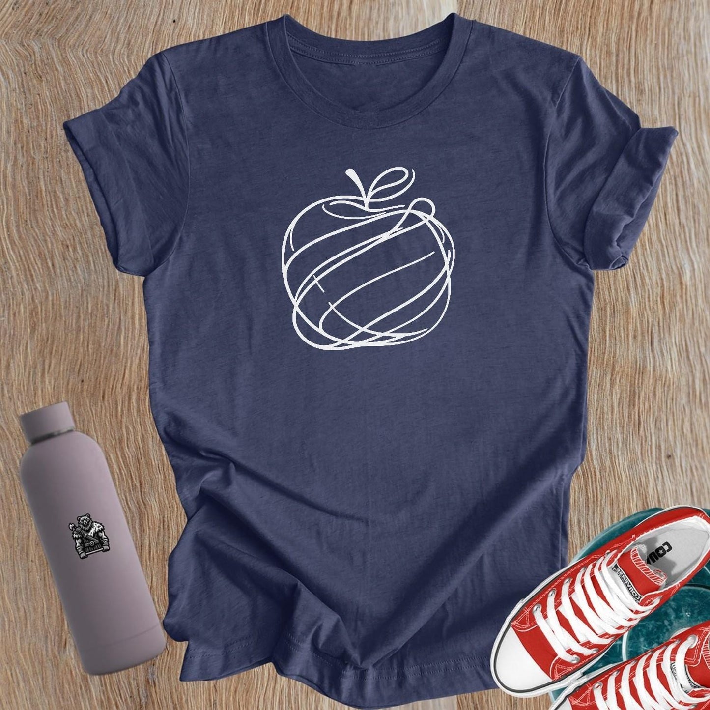 "Empowering women's gym T-shirt with unique apple design, symbolizing health and vitality. Perfect for fitness enthusiasts and lifters."