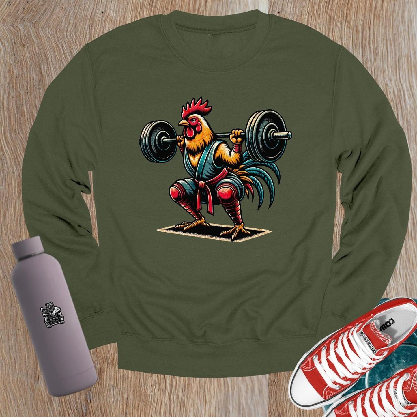 "Fierce weightlifting rooster graphic on a stylish crewneck sweatshirt, perfect for gym enthusiasts. Bold design boosts workout motivation."
