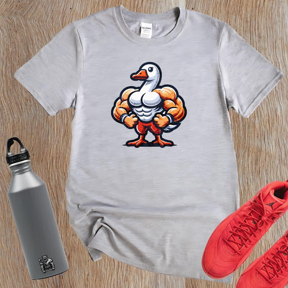 Alt text: "Muscular duck graphic T-shirt for gym enthusiasts, featuring a bold design that combines fun and fitness in a relaxed fit."