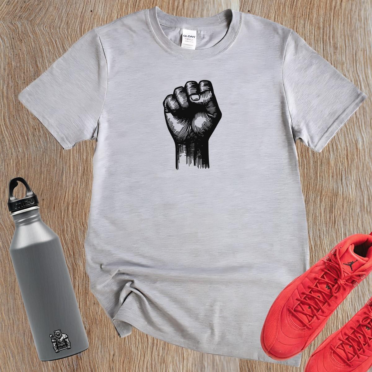 Alt text: "Bold gym t-shirt with a powerful raised fist graphic, symbolizing strength and determination for passionate fitness enthusiasts."