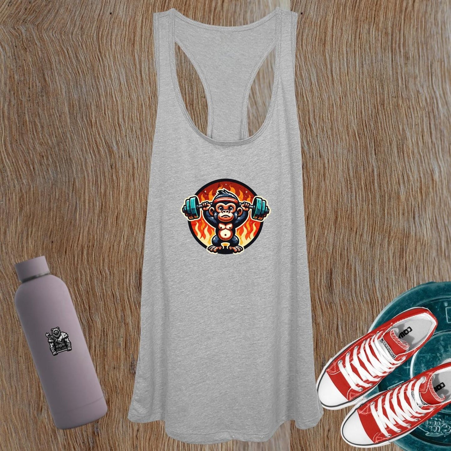 "Women's gym tank top featuring a weightlifting monkey design, blending style and performance for fitness enthusiasts and casual wear."
