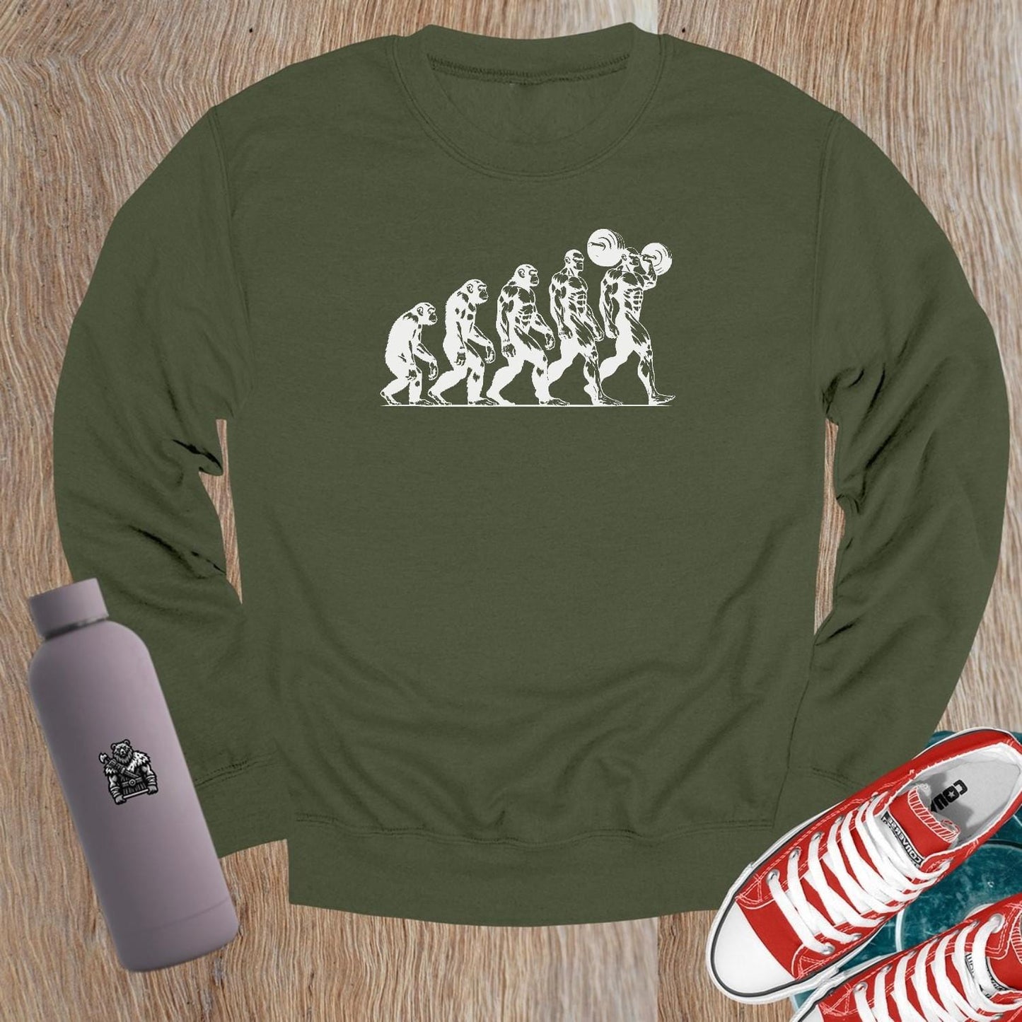 "Graphic gym crewneck sweatshirt featuring bold 'Evolution' design, perfect for fitness enthusiasts to showcase strength and transformation."