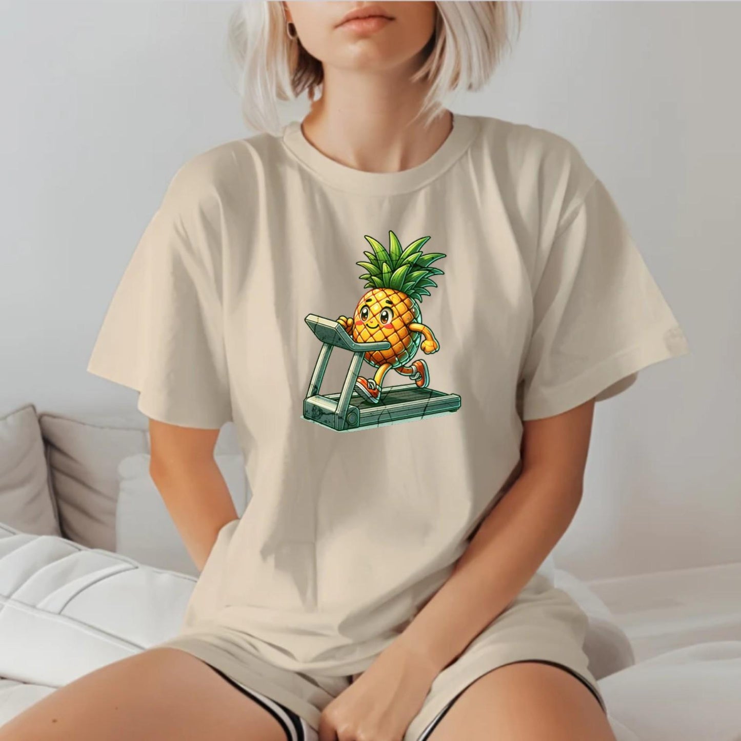 "Bright Pineapple Jogger T-Shirt featuring a cheerful pineapple exercising on a treadmill, promoting fun and motivation in fitness."