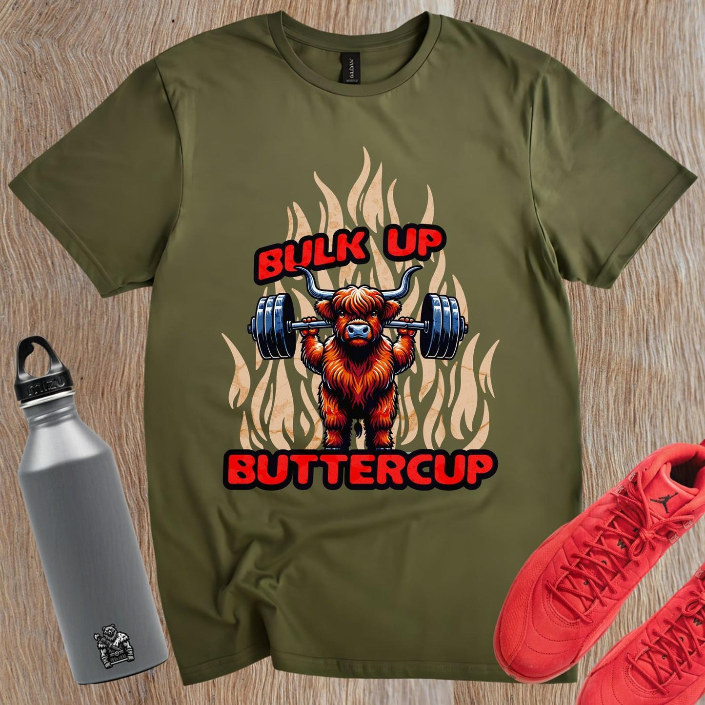 "Bulk Up Buttercup T-shirt featuring a playful lifted Highland cow design, perfect for motivational gym workouts and casual lifting."