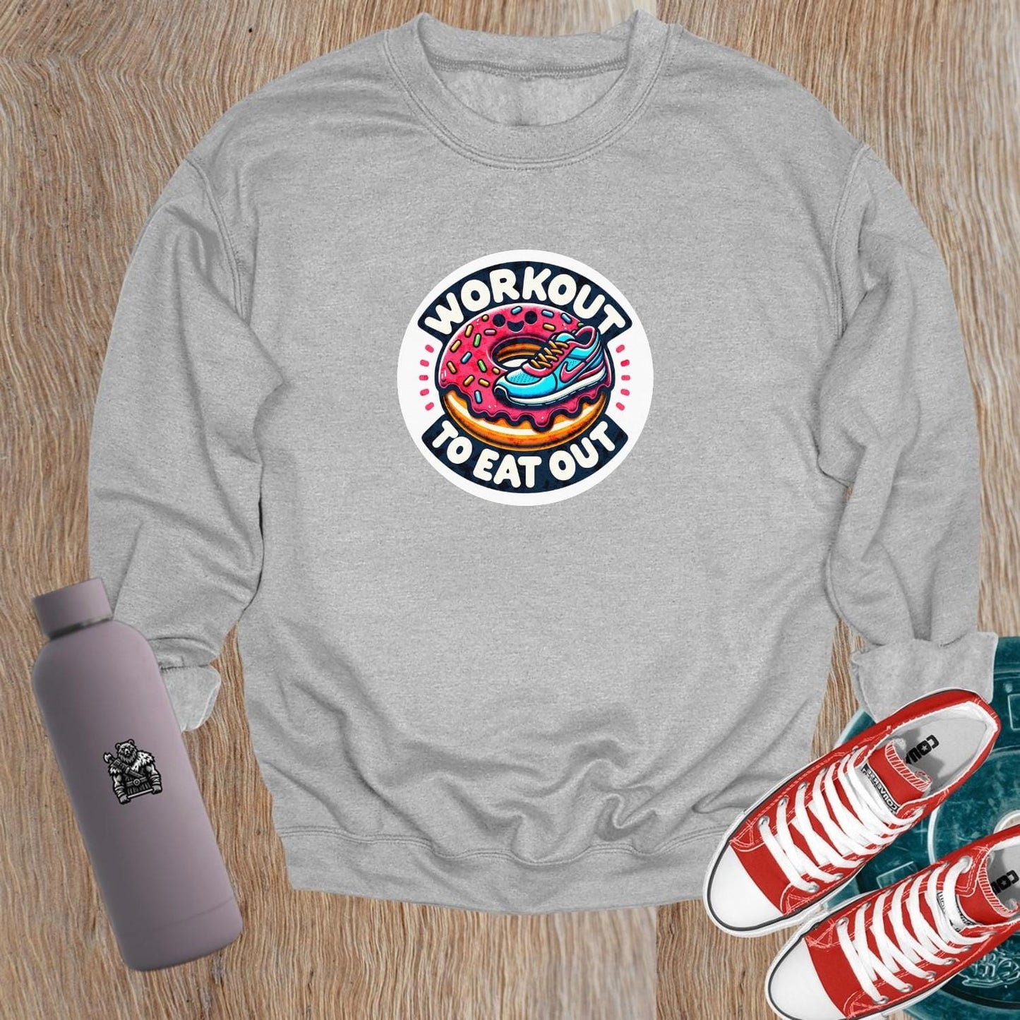 Alt text: "Graphic sweatshirt featuring a vibrant sneaker and donut design, perfect for gym enthusiasts who balance fitness and indulgence."