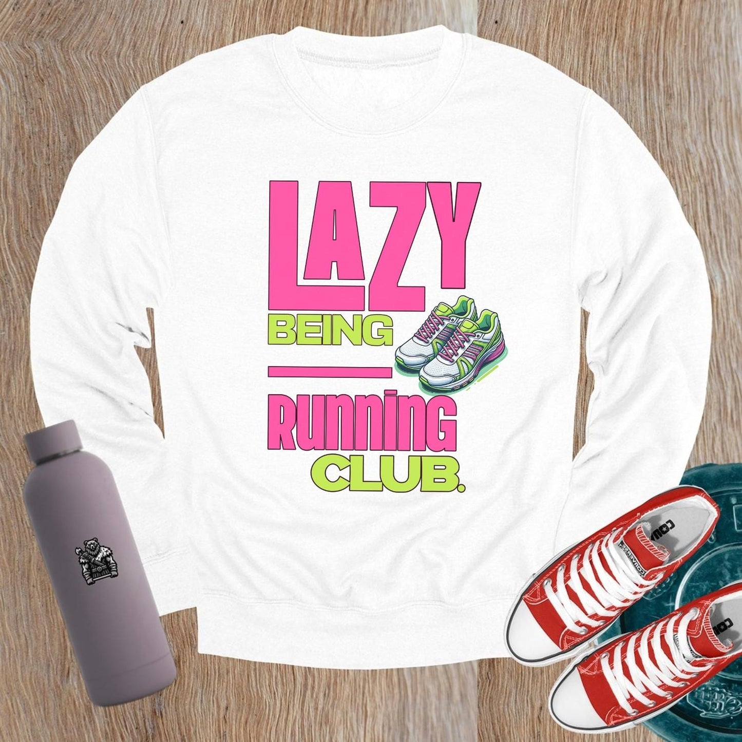 "Vibrant 'Lazy Being Running Club' sweatshirt featuring playful graphics, perfect for fitness enthusiasts and casual wearers at the gym."