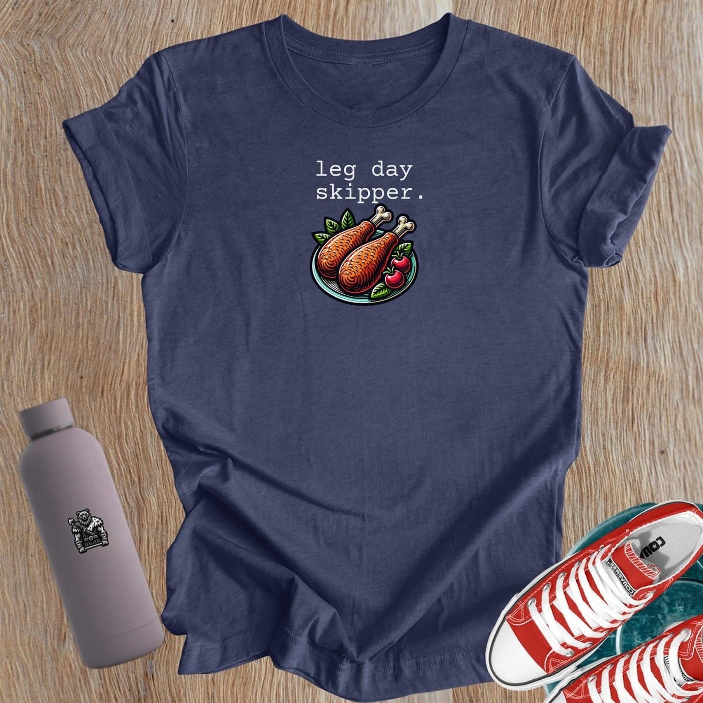 Alt text: "Women’s ‘Leg Day Skipper’ graphic T-shirt featuring bold, humorous design celebrating fitness balance, perfect for gym wear."
