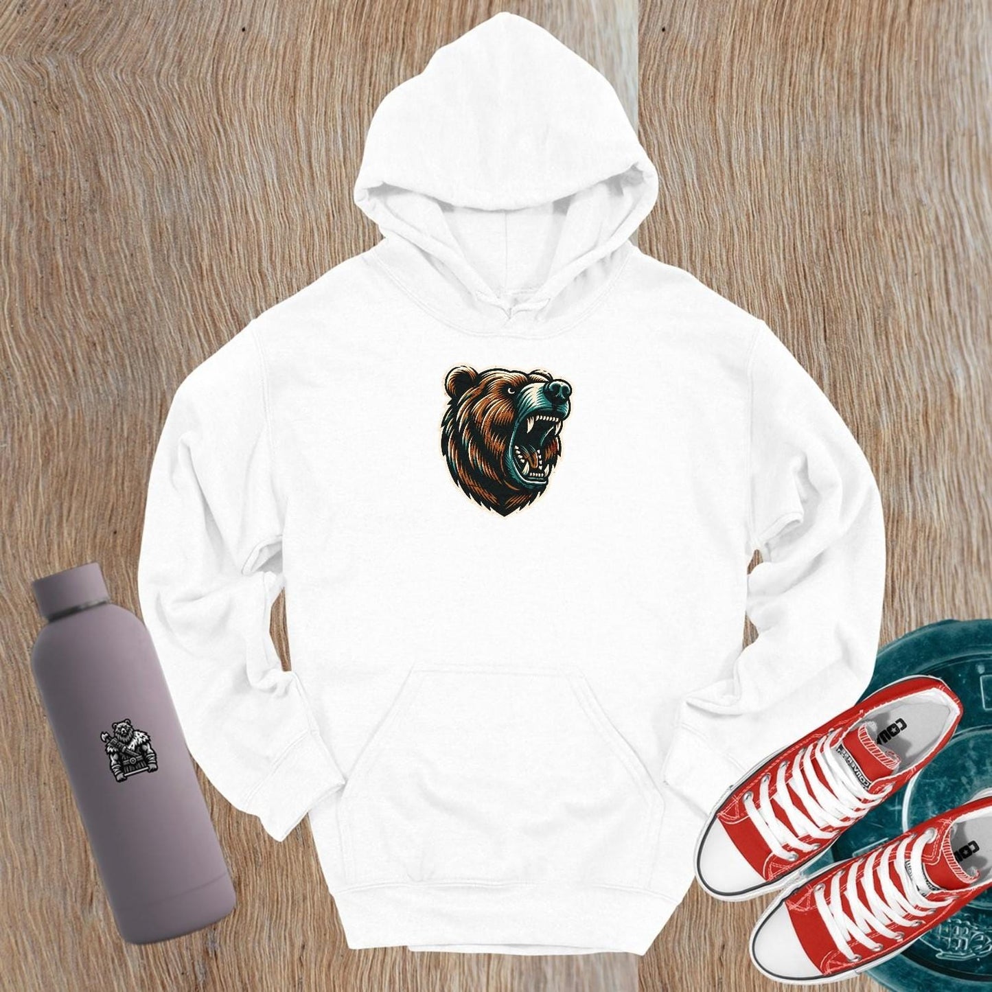 "Bold Bear Hoodie featuring a roaring bear graphic, perfect for empowering workouts or casual wear, showcasing strength and style."