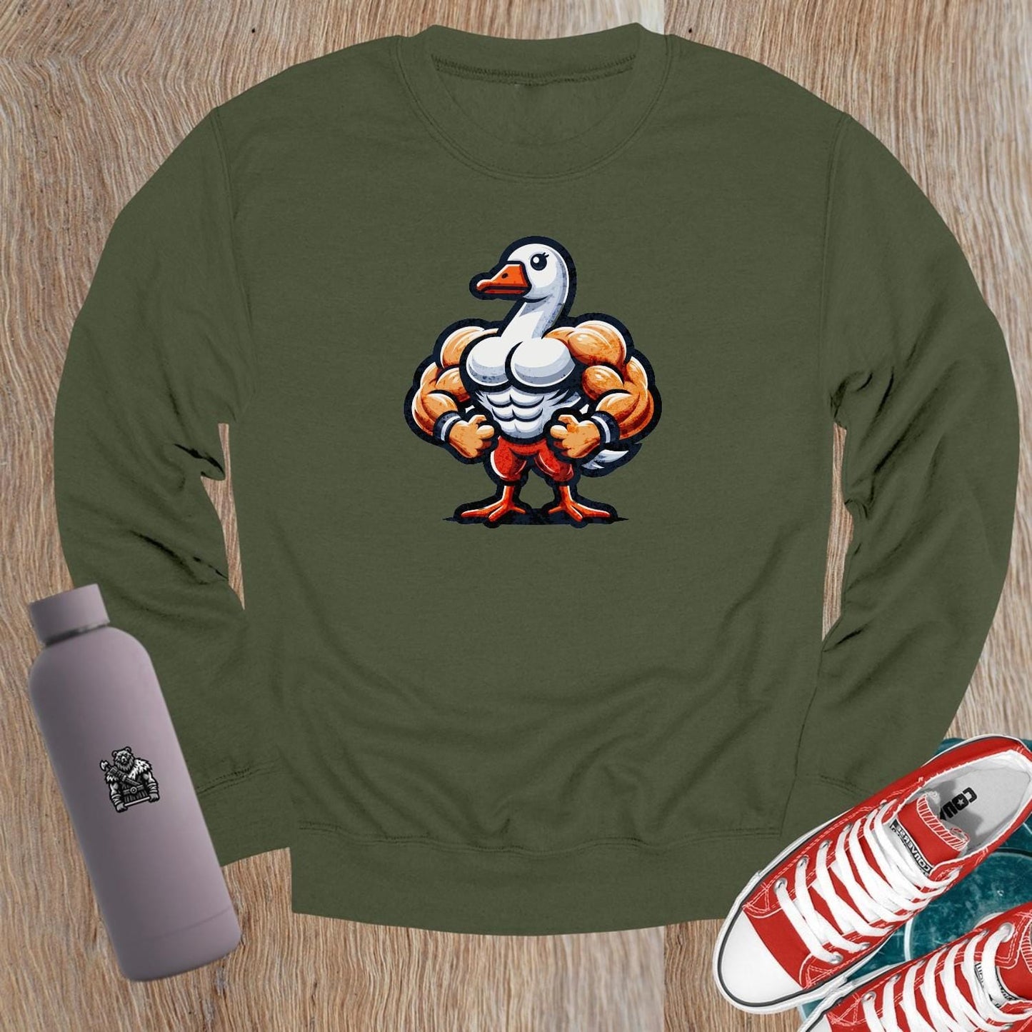 "Graphic crewneck sweatshirt featuring a playful muscular duck design, perfect for gym workouts or casual wear. Bold and unique!"