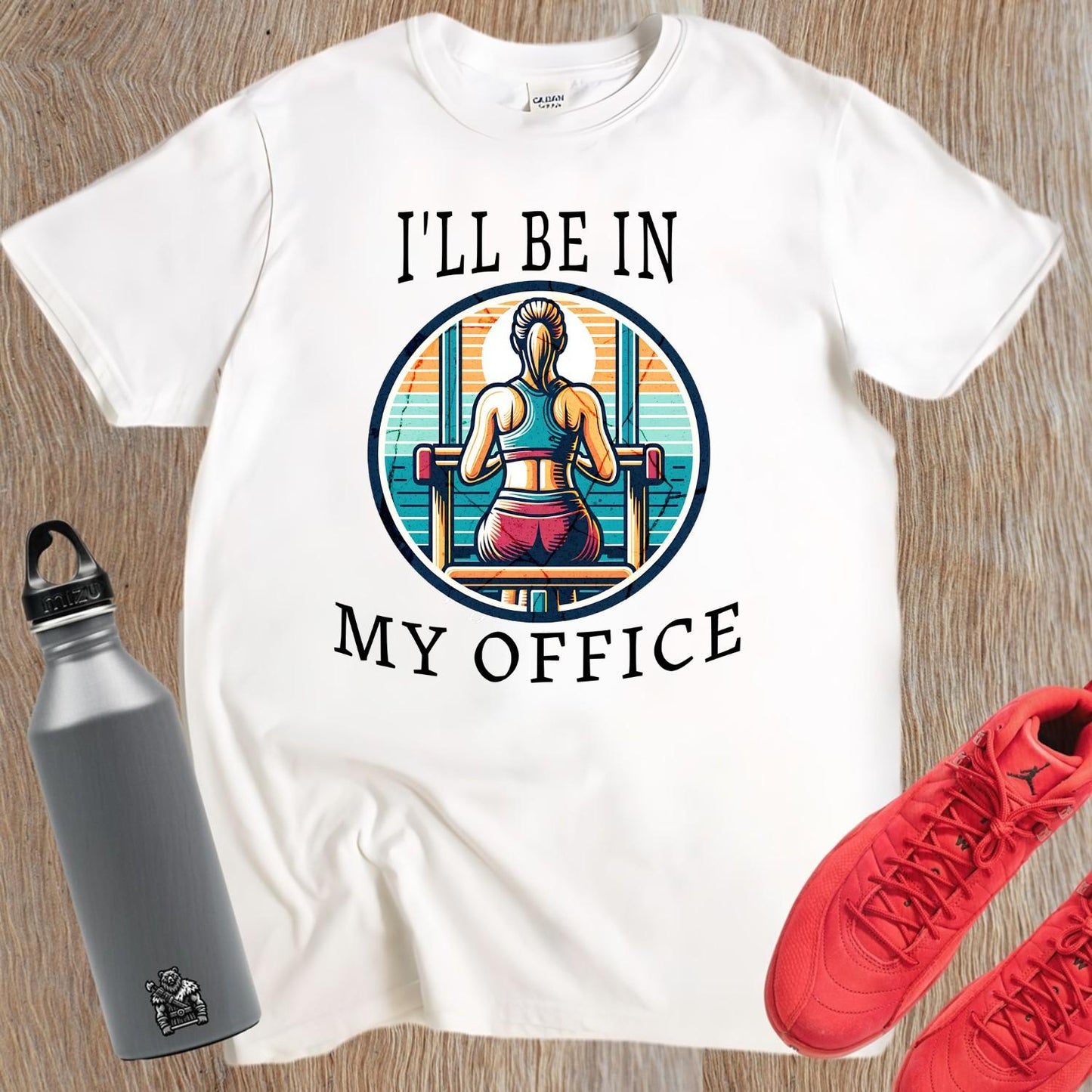 Alt text: "Stylish 'I'll Be in My Office' gym T-shirt featuring a motivational graphic, perfect for workouts and casual outings, embodies fitness passion."