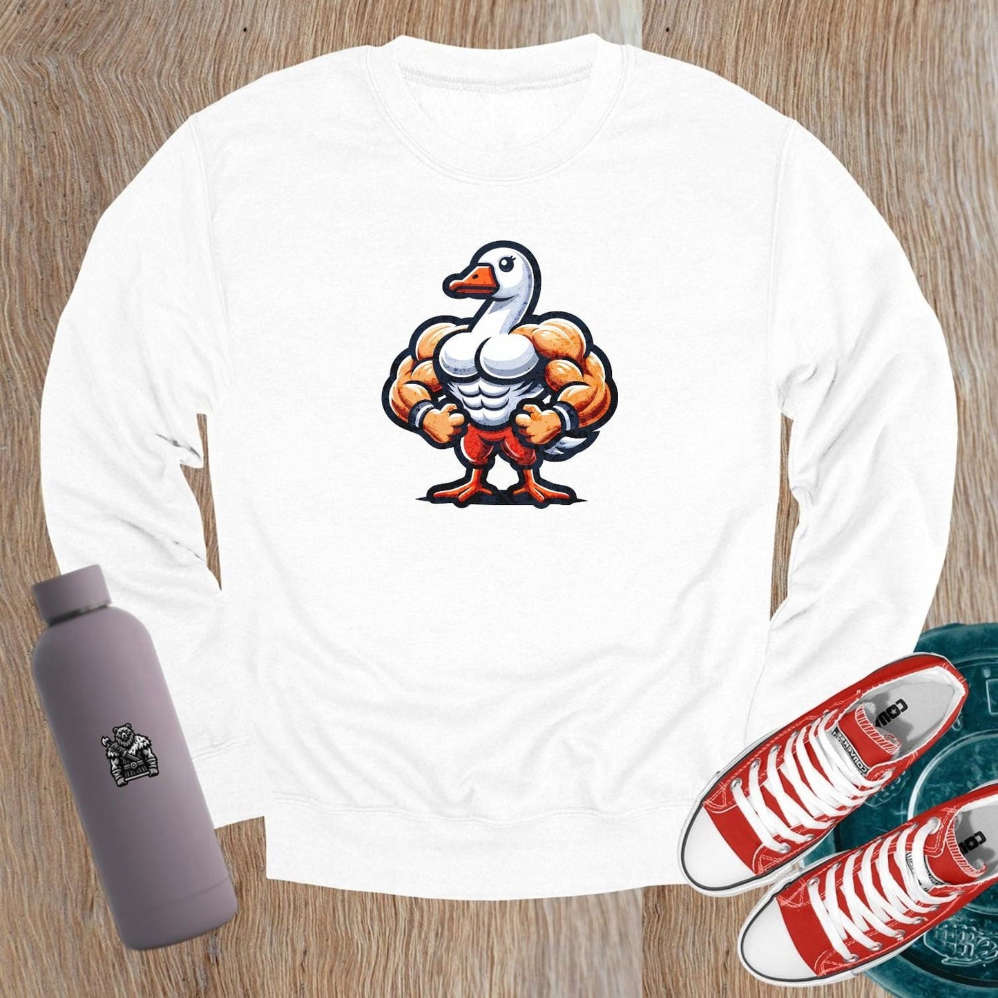 Alt text: "Bold graphic sweatshirt featuring a muscular goose, combining humor and motivation for fitness. Perfect for gym or casual wear."