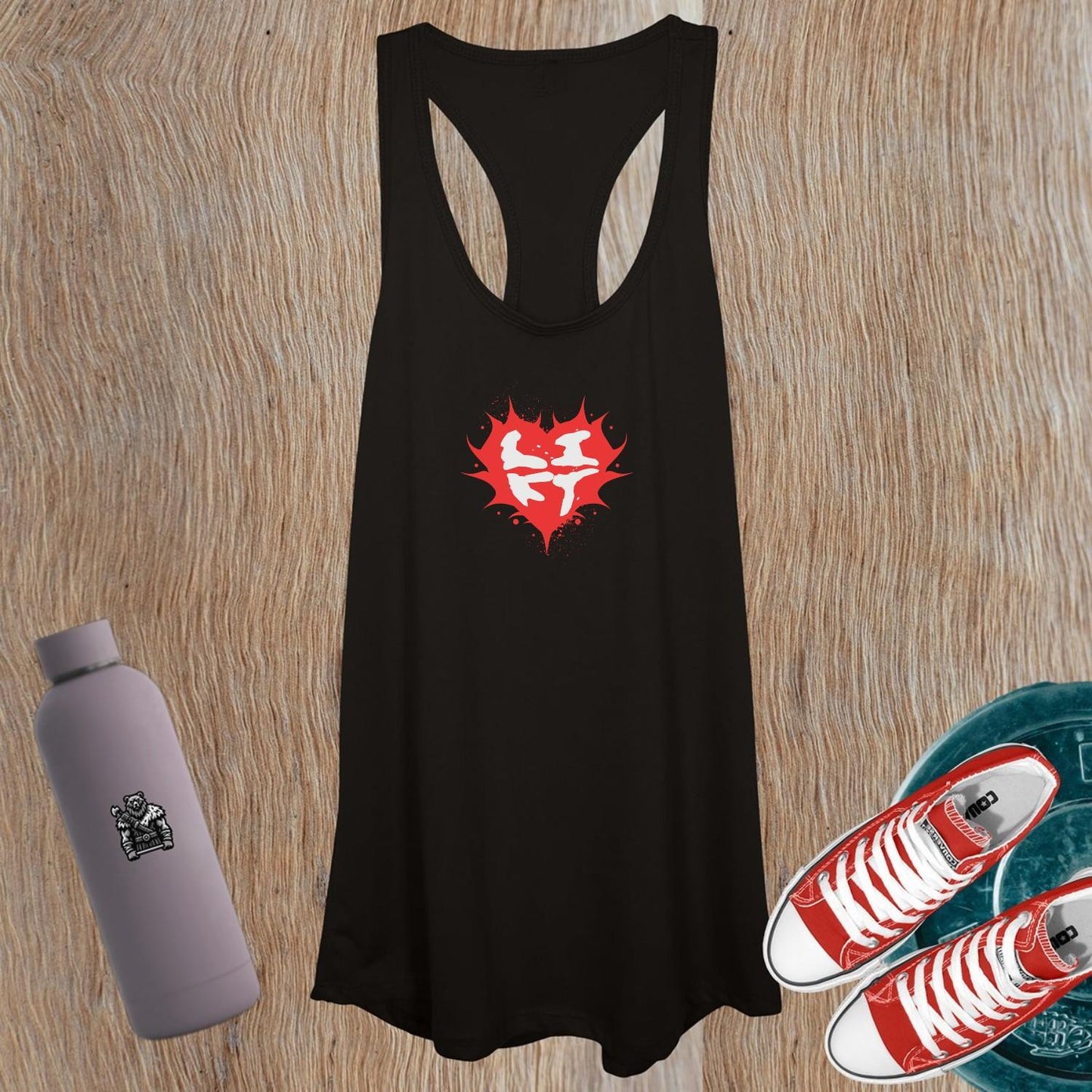 "Women's workout tank top featuring a bold heart design, symbolizing passion and power for fitness enthusiasts. Flattering fit, inspiring graphics."