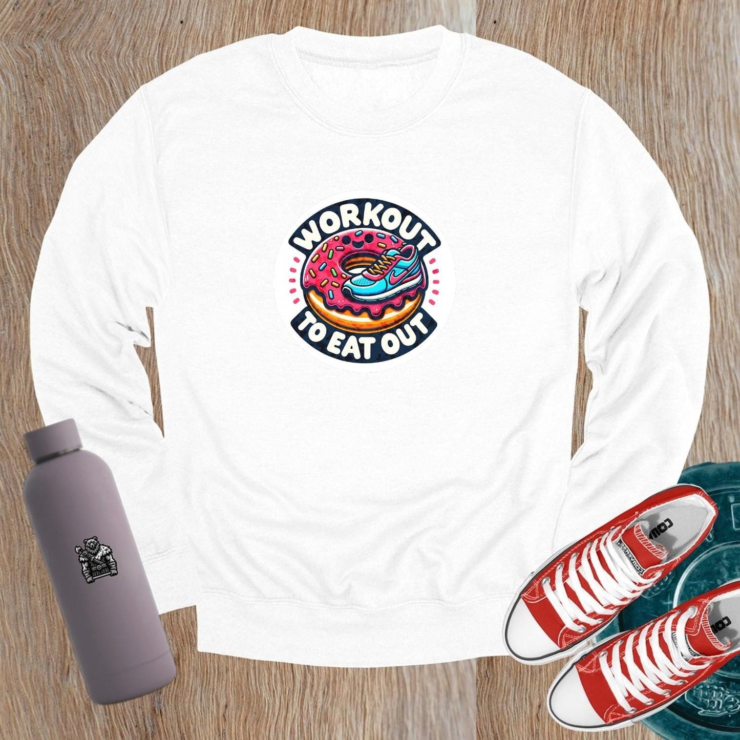 Alt text: "Graphic sweatshirt featuring a vibrant sneaker and donut design, perfect for gym enthusiasts who balance fitness and indulgence."
