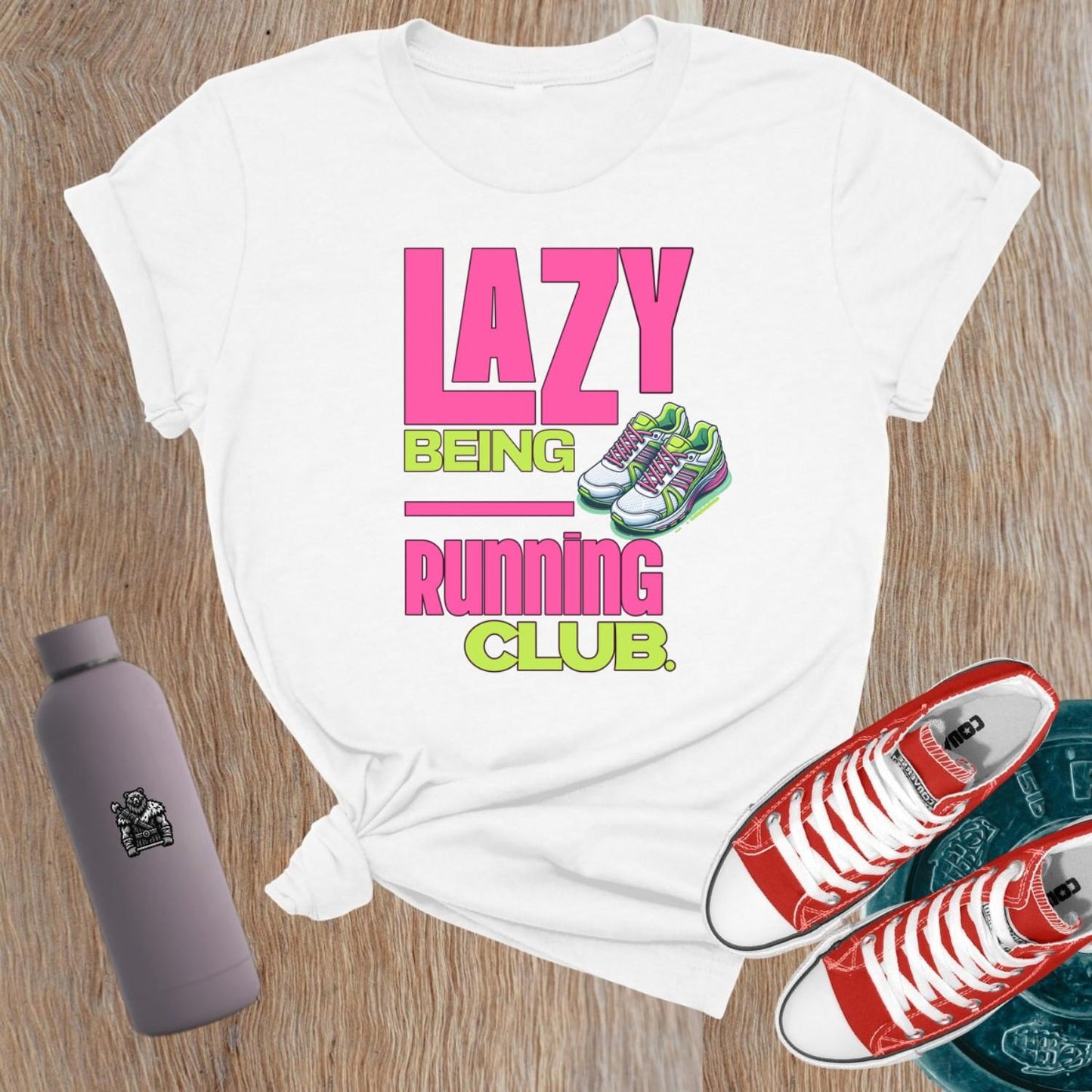 Alt text: "Fierce women's gym t-shirt featuring 'Lazy Being Running Club' bold graphic, perfect for lifting, workouts, and expressing strength."