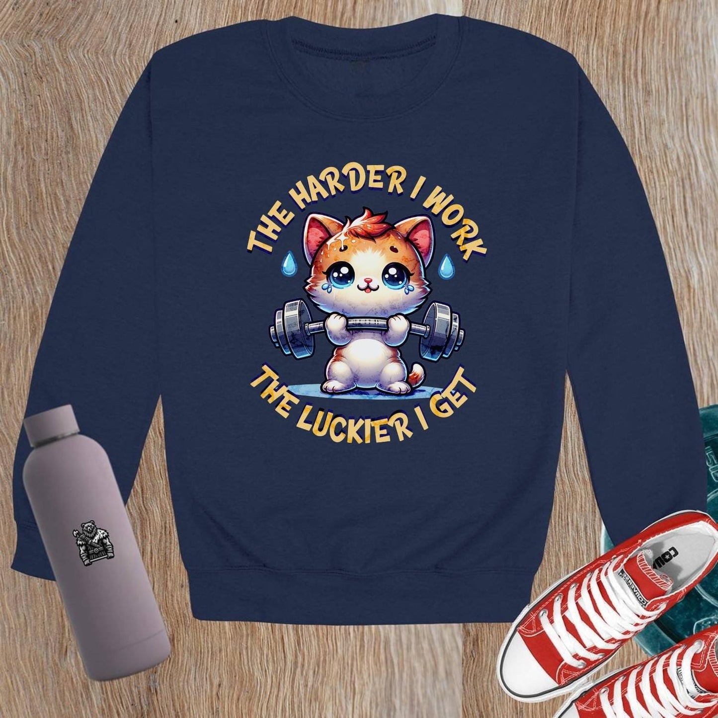 "Adorable crewneck sweatshirt featuring a cartoon kitty lifting weights, motivational design, perfect for gym workouts and lounging."
