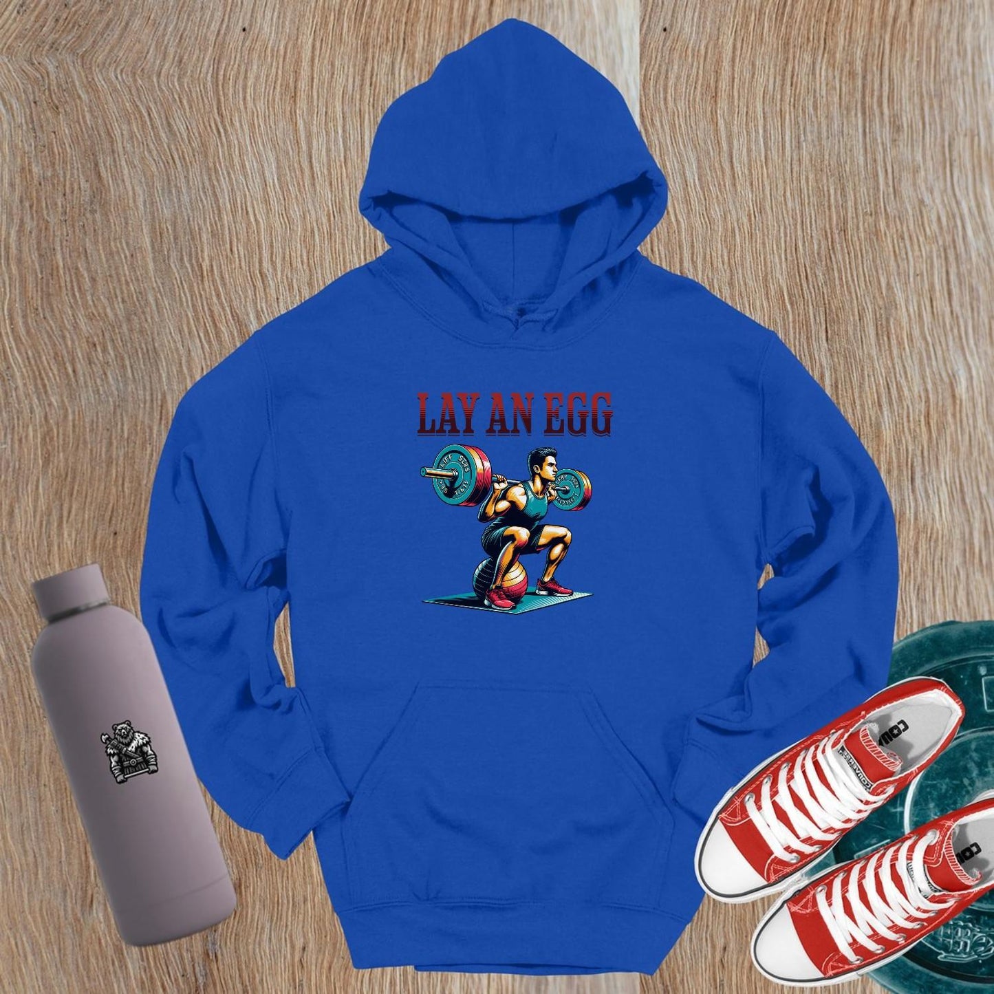 "Colorful gym hoodie featuring a dynamic weightlifter graphic, designed for fitness enthusiasts seeking style and motivation."