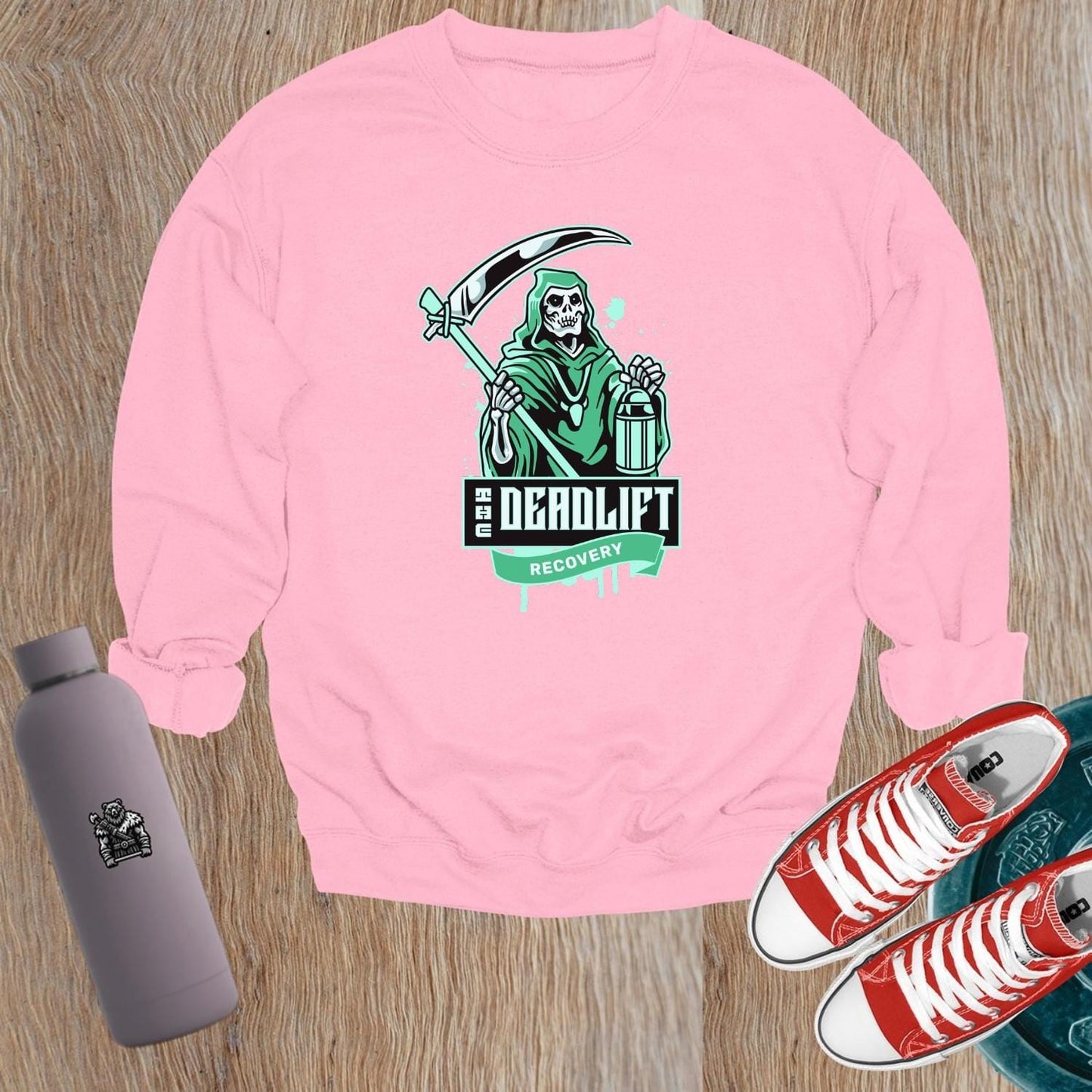"Graphic sweatshirt featuring a bold lifter design, ideal for gym enthusiasts. Perfect for post-workout comfort and style."