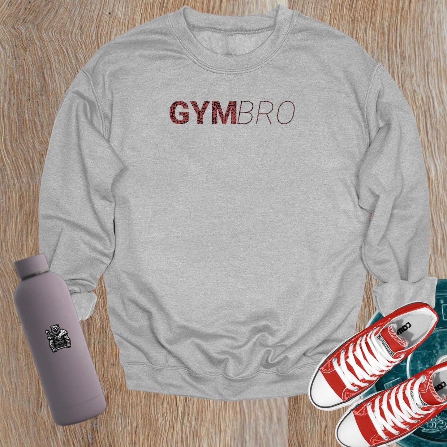 Alt text: "Bold 'GYMBRO' sweatshirt in a relaxed fit, perfect for gym workouts or casual wear, showcasing strength, fitness, and community spirit."