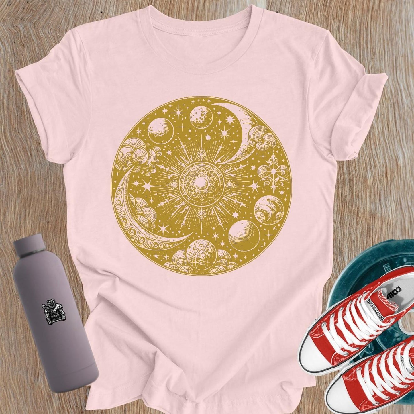 "Women's celestial design gym tee featuring strength symbols, perfect for weightlifting and activewear, blending flair with functionality."