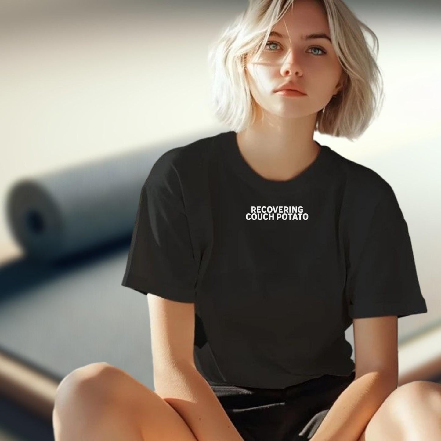 Alt text: "Stylish ‘Recovering Couch Potato’ T-shirt featuring bold graphic design, perfect for workouts or casual outings, showcasing fitness humor."