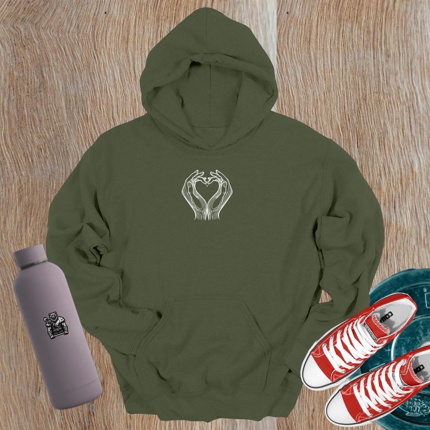 "Stylish gym hoodie with heart-shaped hand design symbolizing strength and unity, perfect for workouts and casual wear."