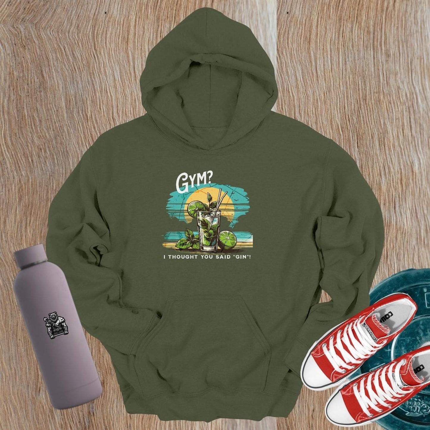 "Humorous 'Gym? I Thought You Said Gin' hoodie in vibrant colors, perfect for gym lovers and casual outings, showcasing playful style."