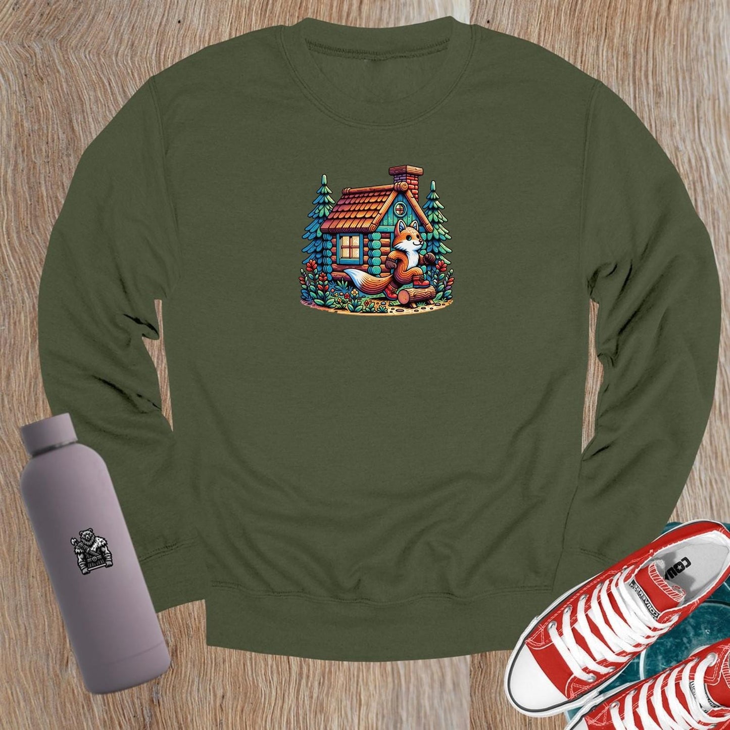 "Cozy crewneck sweatshirt featuring a playful fox beside a charming log cabin, perfect for gym workouts or casual lounging."