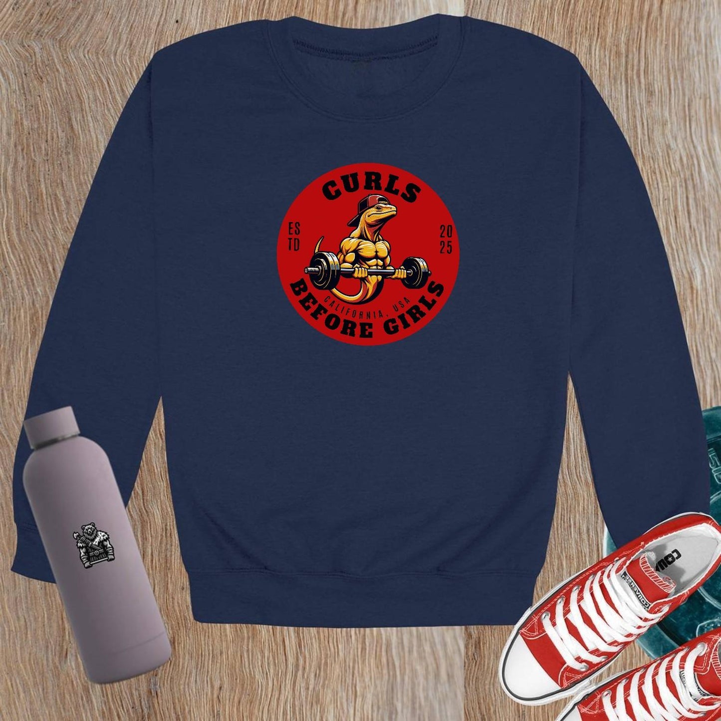 "Dark crewneck sweatshirt featuring 'Curls Before Girls' slogan, vibrant fitness mascot, perfect for workouts and casual lounging."
